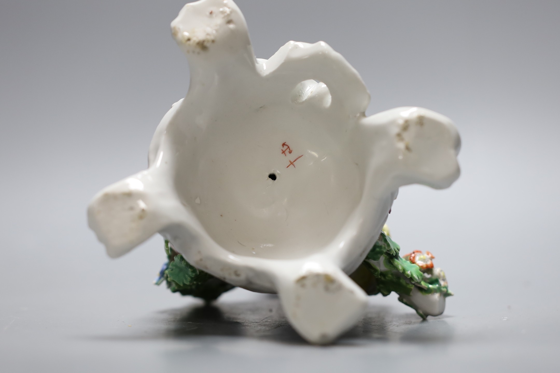 A Bow good figure of Spring on a scroll moulded base painted with flowers, having an anchor dagger mark in red, 16 cms high
